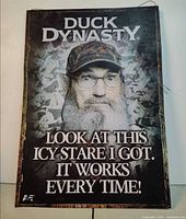Front view of Duck Dynasty metal sign with quote