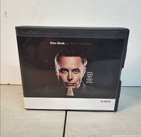 Front view showing title, author, portrait, 16 discs note