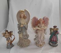 Front view of all four angel figurines