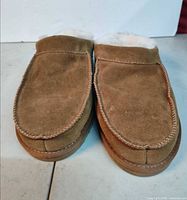 Top view of both slippers showing suede uppers