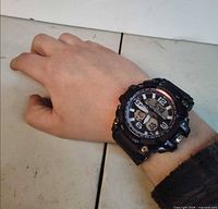 Watch on wrist showing face, dial and strap