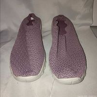 top view of both shoes showing knit uppers and slip-on openings