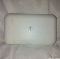 Top view of Phonesoap sanitizer closed, showing lightning bolt logo