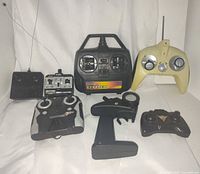 All seven remote controllers laid out front and back rows