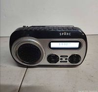 Front view of Sparc SHD-TX2 radio showing speaker, display and controls