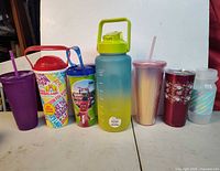 All seven cups lined up front view