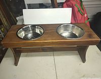 overall view of wooden feeder with both bowls inserted