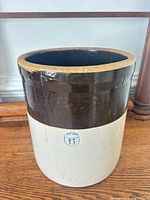 Front view showing two-tone glaze, blue stamp