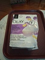 Front of opened 8-bar Olay Age Defy package showing 7 bars present