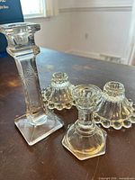Group shot of all four glass candlestick holders