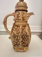 Full view of ceramic decanter showing overall design and condition