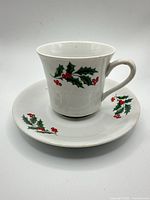 Cup on saucer showing holly pattern