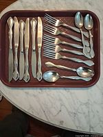 Tray showing knives, forks, spoons