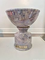 Full view of marbled ceramic decanter assembled with bowl lid