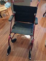 Front view of Drive transport wheelchair with footrests attached