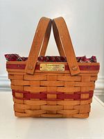 Front view showing basket, liners, brass tag