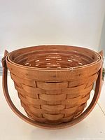 Full front view of basket showing weave and handle