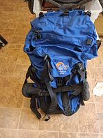 Front view showing lid, logo, straps and overall condition