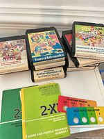Front view showing six cartridge labels and two answer cards