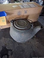 Top view of cast iron kettle showing lid and bail handle