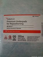 Close-up of product label on package showing brand, product name, size, and absorbency