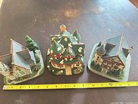All three winter village houses with measuring tape for scale
