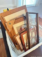 Basket containing multiple wood frames showing variety and condition