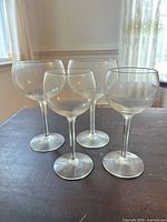 All four stemmed wine glasses grouped