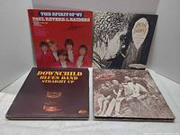 Front covers of four LPs: Paul Revere & the Raiders, Dylan Thomas, Downchild Blues Band, unidentified album