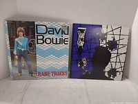 Front covers of both David Bowie records