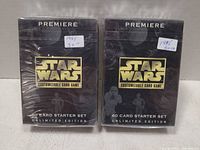Front view of both sealed starter set boxes displaying Star Wars logo and 60 card starter set text
