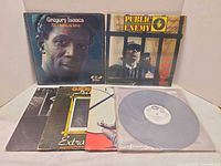 Front covers of Gregory Isaacs and Public Enemy LPs with four additional records partially visible