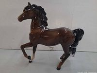 Side profile of porcelain Arab stallion figurine