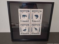 framed square papercut wildlife stamp artwork in black frame