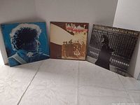 All three album covers displayed upright