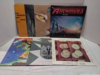 All six album covers laid out together