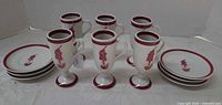 Full set of six mugs on footed bases and six saucers showing pattern and condition