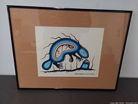 Full view of framed artwork showing image, mat and black metal frame