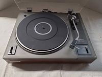 Full view of Pioneer PL-112D turntable with dust cover open