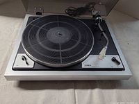 Top view of TAYA MP-200 turntable showing platter, tonearm, headshell, dust cover