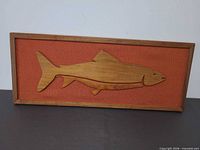Front view showing full fish cutout artwork in frame