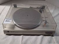 Overall view of Dual CS 514 turntable with dust cover closed