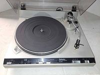 Overall view of Technics SL-3350 turntable with dust cover open