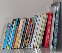 Row of book spines showing titles and authors