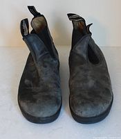 Front view of both boots showing overall design and wear