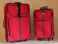 Front view of both red Cambridge suitcases