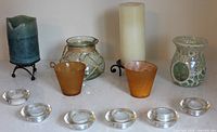 Full lot showing both LED pillar candles on stands, mosaic oil burner, rope-wrapped jar, amber votive cups and six clear tea-light holders