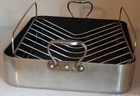 Front view of aluminum roasting pan with rack installed
