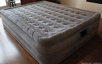 Full view of inflated grey Intex air mattress