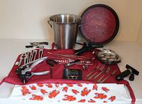 Full lot overview showing tray, bucket, apron, escargot plates and tools